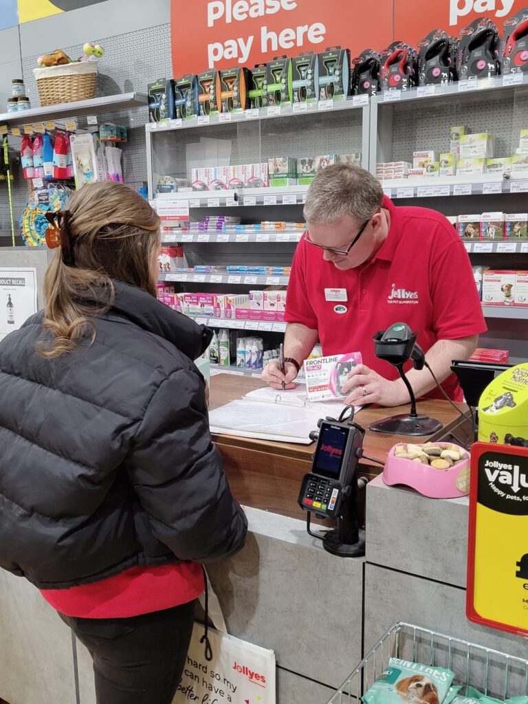 Paul Cartledge SQP supplying a flea treatment to a customer 